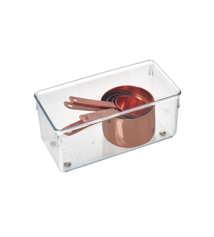 An iDesign LINUS - HIGH drawer organizer in a clear rectangular shape holds nested copper measuring cups with handles, depicted on a white background.